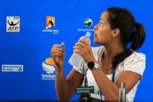 Ana trying to find the source of a strong flow of cold air coming into the press conference room.