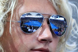 A blonde haired fan watches on at Pat Rafter Arena.