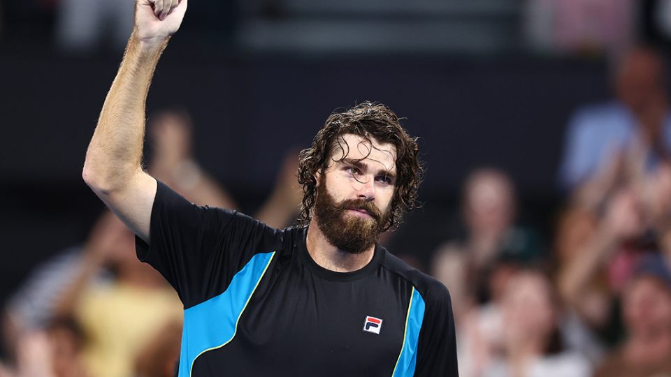 Reilly Opelka salutes the crowd after stunning Novak Djokovic in the 2025 Brisbane International quarterfinals. Photo: Getty Images