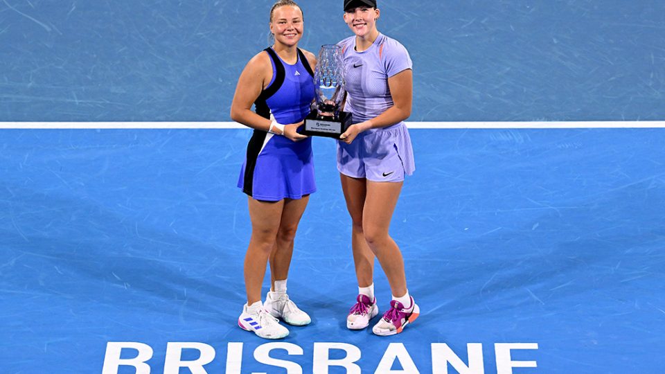 Mirra Andreeva and Diana Schnaider with the 2025 Brisbane International women's doubles trophy after victory over Priscilla Hon and Anna Kalinskaya. Photo: Getty Images